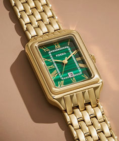 The rectangular Raquel watch is a new classic, updated for the current moment. Slim and versatile, this one-of-a-kind timepiece features a genuine malachite stone dial, three-hand date movement and a brushed and polished gold-tone 7-link bracelet.

Engravable watches. Embossable leather goods. Handpicked jewelry. It’s your destination for those “more than just a gift” gifts—just in time for Mother’s Day. Timeless Rectangular Watches With Subdials, Timeless Rectangular Watch With Polished Finish, Green Watch With Polished Finish And Round Dial, Green Watches With Rectangular Dial And Analog Display, Timeless Green Watch With Analog Display, Timeless Green Analog Watch, Modern Green Watches For Gift, Timeless Green Watch Accessories With Metal Dial, Luxury Green Watches With Polished Finish