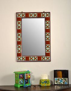 a mirror sitting on top of a wooden table