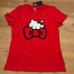 a red shirt with a hello kitty on it