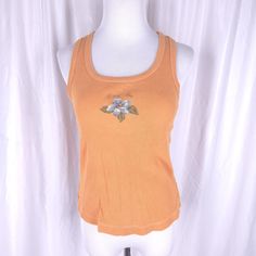 Vintage y2k orange ribbed Hang Ten tank top. In excellent vintage condition. Tag size large.  Measurements (laying flat) Chest 15 inches underarm to underarm Length 21 inches top of shoulder to bottom hem Y2k Stretch Tank Top For The Beach, Y2k Style Stretch Tank Top For Beach, Y2k Tank Top For Beach, Y2k Tank Top For The Beach, Y2k Style Tank Top For The Beach, Y2k Style Ribbed Tank Top For Summer, Orange Stretch Tank Top, Spring Y2k Scoop Neck Tank Top, Orange Stretch Summer Tank Top