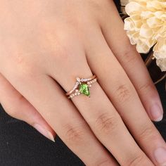 Unique Peridot Engagement Ring Set Dainty Green Gemstone Rose - Etsy Peridot Engagement Ring Silver, Peridot Wedding Rings, Green Heart Cut Rings For Wedding, Green Heart Cut Wedding Rings, Heart Cut Diamond Emerald Ring For Wedding, Diamond Ring For Wedding With May Birthstone, Diamond Wedding Ring For May Birthstone, May Birthstone Solitaire Ring For Wedding, Green Wedding Rings With Accent Stones