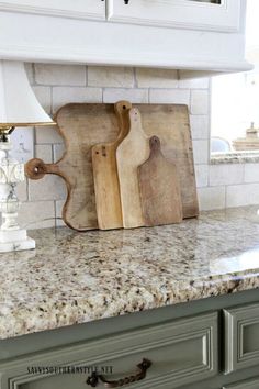 a kitchen counter with cutting boards on it