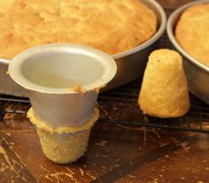 three pans filled with food sitting on top of a metal rack next to each other