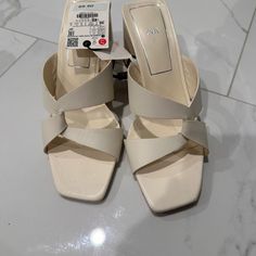 Never Worn Beige Block Heel Wedge Sandals For Spring, Cream Open Toe Heels For Summer, Summer Cream Open Toe Heels, Beige Wedge Sandals With Padded Heel For Summer, Chic Beige Mules For Spring, Cream Block Heel Wedge Sandals For Spring, Spring Cream Wedge Sandals With Block Heel, Cream High Heel Sandals For Summer, Cream Open Heel Sandals For Summer