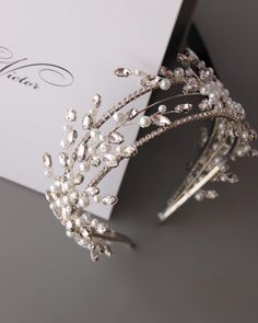 a tiara is sitting on top of a card