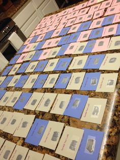 several rows of business cards sitting on top of a counter next to a stovetop