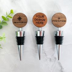 three wine bottle stoppers with personalized corks