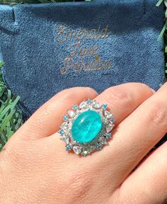 4 Cabochon PARAIBA Blue Halo Vintage Style Ring, Magnificent Vivid Ocean Blue Statement Ring For Her Adjustable Size 6-8 w 18KGP Mainstone size is 8x10mm 4 Carat Overall size is 22x22mm ♥Ready to ship ♥ The main stone is the Finest Doublet PARAIBA TOURMALINE. ♥Absolutely gorgeous and beautifully handcrafted Finest Doublet PARAIBA TOURMALINE in an exquisite setting. ♥ This classic yet trendy Jewelry makes the perfect Christmas/Anniversary/Valentine's/Birthday gift for her that will be treasured f Fine Jewelry Blue Cabochon Sapphire Ring, Blue Cabochon Sapphire Ring In Fine Jewelry Style, Blue Cabochon Diamond Ring, Formal Cabochon Blue Topaz Jewelry, Blue Diamond Cabochon Ring, Blue Emerald Rings With Halo Setting, Blue Emerald Ring With Halo Setting, Blue Diamond Ring With Cabochon Cut, Blue Emerald Halo Setting Ring