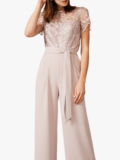 A head-turning alternative to an occasion dress, this tailored jumpsuit has a contrast lace bodice overlay, semi-sheer short scallop sleeves, and a flattering waistband to define the silhouette. Wear with metallic accessories for a full formal look. Scallop Sleeves, Enby Outfits, Ruffle Velvet Dress, Metallic Accessories, Women Suits Wedding, Tailored Jumpsuit, Suits Wedding