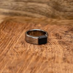 a ring sitting on top of a wooden table