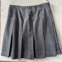 Box Pleat Grey Skirt. Never Been Worn With Tags. Was Purchased From Mills Company Which Is Now Dennis Uniform. Gray Pleated School Bottoms, Gray Pleated Bottoms For School, Classic Skort For School, Classic School Skort, Classic Mini Skirt For School, Uniform Style Fitted School Skirt, Gray Fitted Skirt For School, Fitted Gray Skirt For School, Classic Fitted Skirt For School