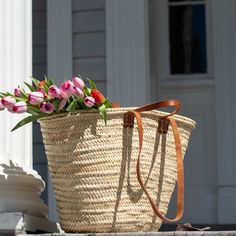 Look chic and smart while you stroll the farmer's market with your classic French tote basket. Switch between two sets of leather handles, long shoulder straps for when you want your hands free and short tote handles when you want to hand-carry your basket. This basket is ready for adventure! Use it as a beach bag, a pool tote, or a spacious picnic basket. When you're home, it makes for an attractive storage option hanging up or in a corner. Keep your basket in your car or display it on a hook n Classic Straw Bag With Leather Handles For Travel, Classic Straw Tote Bag With Braided Handles, Leather Straw Bag With Rolled Handles For Travel, Classic Straw Tote Bag For Everyday Use, Classic Straw Bag With Braided Handles For Travel, Leather Straw Bag With Rolled Handles For Daily Use, Daily Use Leather Straw Bag With Rolled Handles, Classic Natural Straw Bag For Everyday Use, Classic Natural Straw Travel Bag