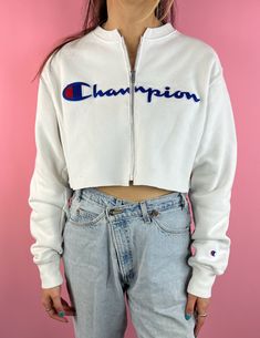 "Vintage Champion Cropped Zip-up Sweatshirt (S) Size: Adult Small Zipper length is 13\" long Model is 5'9\" NOTE: this sweatshirt is vintage, so some wear, tear and spots may, but not always, be present" 90s Long Sleeve Sweatshirt For Fall, 90s Style Long Sleeve Fall Sweatshirt, 90s Long Sleeve Fall Sweatshirt, 90s Style Cotton Sweatshirt For Fall, 90s Cotton Sweatshirt For Fall, Vintage Tops With Ribbed Cuffs For Spring, Vintage Ribbed Cuffs Top For Spring, Vintage Letter Print Sweatshirt For Spring, Vintage Fleece Tops For Streetwear