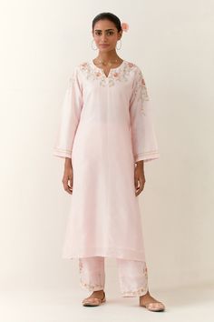 Light pink hand embroidered silk chanderi kurta with notched neckline. Paired with embroidered palazzo.
Components: 2
Pattern: Embroidered
Type Of Work: Floral
Neckline: Notched
Sleeve Type: Long
Fabric: Silk Chanderi
Color: Pink
Other Details: 
Embroidered palazzo
Occasion: Puja - Aza Fashions Kurta And Palazzo, Notched Neckline, Palazzo Set, Fashion App, Fabric Silk, Pink Silk, Embroidered Silk, Set For Women, Aza Fashion