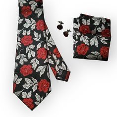 The Silk Black Red Floral Tie Set is the perfect addition to your formal wardrobe. Made from high quality silk, this elegant tie is adorned with a beautiful red and black floral pattern that is sure to make a statement at any formal occasion. The set includes a coordinating pocket square and cufflinks, completing the look with a touch of sophistication. 100% Silk Handmade Package Includes: Tie, Pocket Square & Cufflinks. Length: 59" Width: 3.34" Warm iron if needed Elegant Red Suit And Tie Accessories For Gift, Elegant Red Suit And Tie Accessories For Black-tie Events, Elegant Sets With Ties As Gift, Elegant Red Business Sets, Elegant Red Formal Sets, Elegant Red Suit And Tie Accessories For Formal Occasions, Elegant Red Suit And Tie Accessories For Formal Events, Black Floral Pattern, Argyle Socks