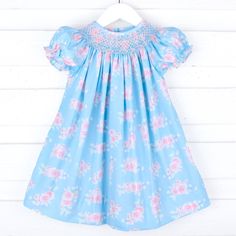 This Pink Roses Smocked Blue Bishop Dress is made for picture-perfect Fall photos! This blue dress, adorned with pink roses, features adorable geometric smocking and bishop-style sleeves for a timeless look. Geometric Smocking, Boys Belt, Girl's Back, Street Kids, Bubble Dress, Fall Photos, Girl Falling, Fall Collections, Shop Swimwear