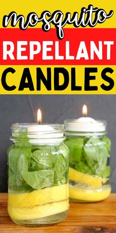 two mason jars with lemons and spinach in them on a wooden table next to a candle