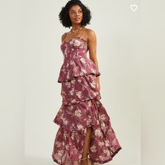 This Floral Sleeveless Maxi Dress With A Corset Top Design, Lace-Up Back, And Tiered Ruffle Skirt Embodies Romance And Elegance. This Dress Is Perfect For A Wedding, Special Occasion Or A Romantic Date. The Corset Top Hugs Your Body, While The Ruffle Skirt Adds A Playful Touch, Creating An Alluring And Sophisticated Look! * Fit: Fitted At Bust With Flowy, Effortless Skirt * Closure: Zipper, Lace Up * Material: 100% Polyester, Lining: 100% Polyester * Adjustable Tie Straps * Sleeveless * Imported Fitted Sleeveless Maxi Dress For Garden Party, Floral Print Strapless Sleeveless Dress For Date Night, Floral Print Strapless Dress With Fitted Bodice, Strapless Floral Dress With Fitted Bodice, Formal Sleeveless Floral Print Dresses, Fitted Tiered Maxi Dress For Cocktail, Silk Maxi Dress With Fitted Bodice And Sleeveless Design, Sleeveless Floral Print Maxi Dress For Cocktail, Corset Top Design