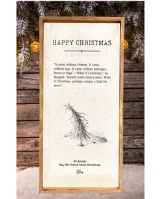 an old fashioned christmas card hanging from a wooden frame in front of a pine tree