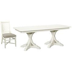 a white table and two chairs sitting next to each other