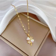 Lucky Four Clover Necklace For Women Stainless Steel Flower Pendant Golden Color Necklaces Fashion Perfect For Weddings, Special Occasions, Or As A Thoughtful Gift For Loved Ones Elegant White Flower-shaped Necklaces, White Heart-shaped Jewelry With Flower Charm, Pearl White Flower Necklace, Elegant White Flower Necklace For Anniversary, Elegant White Flower Necklace, White Feminine Necklace With Flower Charm, White Flower Pendant Necklace With Clavicle Chain, Feminine White Necklaces For Mother's Day, Feminine White Necklace With Flower Charm