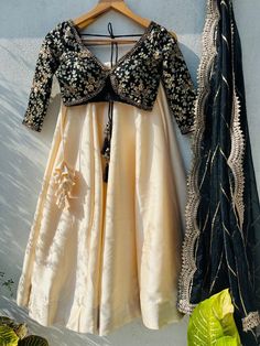 🖤Black And Beige Sabyasachi Lehenga Set. Black sharmily blouse with bold cuts and elegant embroidered in sequin, zardozi and with contrasting beige silk lehenga. and dupatta is in organza with sequin work highlight and scallop edging. This lehenga set can be made in Your Choice COLOR combo. Please message us if you want this in a different color. Blouse: Sequins, zardosi, and embroidery on black Raw Silk fabric. Lehenga: Art raw silk fabric Dupatta: Organza fabric Our products are 100% authenti Anarkali Lehenga For Party During Eid, Semi-stitched Floor-length Choli For Festive, Semi-stitched Floor-length Festive Choli, Festive Semi-stitched Floor-length Choli, Floor-length Choli With Pallu For Eid, Party Wear Semi-stitched Choli For Eid, Semi-stitched Party Wear Choli For Eid, Party Choli With Resham Embroidery In Raw Silk, Silk Lehenga With Resham Embroidery For Party Wear