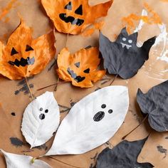 paper leaves with faces and bats on them