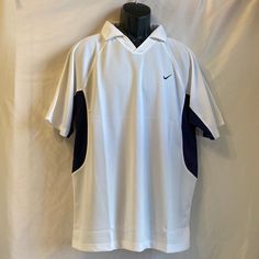 Nike Dri Fit White/Blue Polo Style Shirt Size Xxl Embroidered Nike Emblem On Left Side 100% Polyester New With Tag White Summer Sports Shirt, White Relaxed Fit Sporty Shirt, Nike Classic Fitted Tops, Classic Fitted Nike Tops, Classic Short Sleeve Sports Shirt, White Polo Collar Sports Top, Sporty White Collared Tops, White Collared Sporty T-shirt, Nike Short Sleeve Polo Shirt For Sports