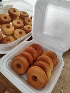 there are many doughnuts in the box on the table and one is empty