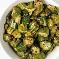 a white bowl filled with cooked brussel sprouts