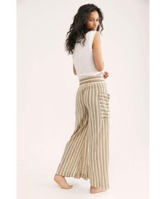 Perfect for any occasion, these effortless wide leg pants are featured in a textured, striped fabrication with exaggerated pockets and drawstring waistband in a high-rise silhouette. Elastic waistband Semi-sheer fabrication Effortless pull-on style Care/Import Machine Wash Cold Gentle Import Measurements for size small Waist: 28 in Rise: 14 in Inseam: 29 in Fabric Content: 100% Cotton Jones Beach, Free People Store, Wide Leg Pant, Pj Sets, Small Waist, Trouser Pants, Drawstring Waistband, Stripe Print, Leg Pants