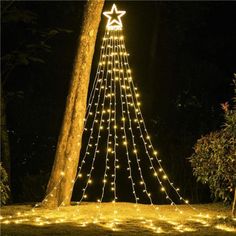 a christmas tree with lights in the shape of a star on it's side