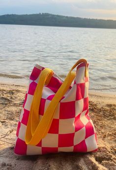 A spacious and trendy tote bag to help you carry around everything that matters. 😎 I happily fit my Macbook in here for my coffee runs! 💻 Please note: this bag does not have pockets inside. 💖 Made of polyester fabric & natural cotton 💖 Bag size: 15″ × 15″ (38.1 × 38.1 cm) 💖 Capacity: 2.6 US gal (10 l) Pink Square Canvas Bag For Travel, Pink Square Bag For Summer, Pink Square Canvas Bag For Everyday Use, Trendy Pink Canvas Bag For The Beach, Trendy Tote Shoulder Bag For Picnic, Trendy Rectangular Beach Bag For Picnic, Trendy Pink Canvas Beach Bag, Retro Pink Shoulder Bag For Summer, Trendy Rectangular Beach Bag For Picnics