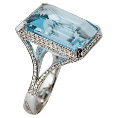 "Costis" Aquamarine Ring with 29.42 carats Aquamarine and Diamonds A simple, yet elegant setting to celebrate remarkable aquamarines. Every design is a challenge, starting from the highly demanding three-dimensional pieces, to the ostensibly simplest settings. Costis actually believes that what seems to be simple in appearance is the hardest to achieve. This does not mean less hours in the design room and in the workshop, but instead respect to the quality and value of the central gemstones. 18K White Gold. The ring features a 29.42 carats central stone surrounded with a total of 1.55 carats of Diamonds. Aquamarines remind Costis the hues of the Greek surroundings... the sea, the sky, the horizon... characteristics that he always uses in his pieces. Design Room, Aquamarine Ring, Aqua Marine, Aquamarine Rings, Cocktail Rings, Three Dimensional, Aquamarine, Diamond Ring, Jewelry Rings