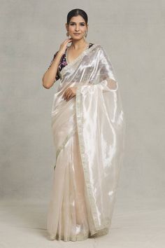 Silver tissue saree with floral pattern, metallic sequin and zari lace embellished border. - Aza Fashions Elegant Chanderi Pre-draped Saree For Celebration, White Silk Pre-draped Saree With Mirror Work, Elegant Organza Pre-draped Saree For Navratri, Cotton Silk Pre-draped Saree With Mirror Work, Festive Cotton Silk Pre-draped Saree For Celebration, Festive Cotton Silk Pre-draped Saree With Sheer Dupatta, White Chanderi Pre-draped Saree For Celebration, Celebration White Pre-draped Saree With Dupatta, Semi-stitched Cotton Silk Pre-draped Saree For Celebration