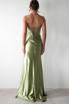 the back of a woman in a green dress