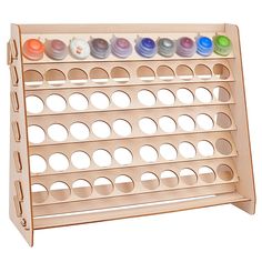 a wooden display rack with several different colored buttons on the top and bottom half of it