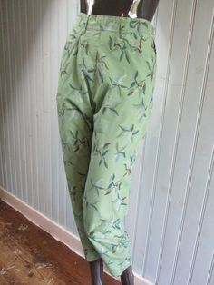 Vintage cotton trousers in pale green with a darker green flower pattern.  The waist is half elasticated and they have two  pockets. Dimensions: Waist: 28 Inches. Hip: 40 Inches. Leg:  37 Inches Made in India Green Summer Harem Pants With Pockets, Spring Green Straight Leg Harem Pants, Green Wide Leg Harem Pants For Spring, Spring Green Harem Pants With Elastic Waistband, Green Harem Pants With Elastic Waistband For Spring, Summer Green Harem Pants With Elastic Waistband, Green Relaxed Fit Harem Pants With Elastic Waistband, Green Harem Pants With Elastic Waistband, Bohemian Straight Leg Harem Pants For Spring