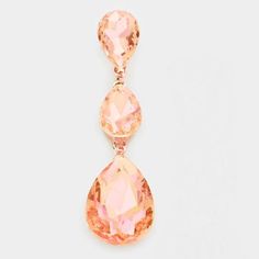 Peach Crystal Triple Crystal Teardrop Evening Rose Gold Earrings by Miro Crystal CollectionItem: EarringsBrand: Miro Crystal CollectionColor : Rose Gold , Peach Size : 0.75" X 3" Fastening: Post BackMaterial: CrystalMetal: AlloyTheme: Evening, Prom, Pageant Teardrop Jewelry, Rose Gold Earrings, Bridal Earrings, Jewelry Set, Gold Earrings, Pearl Earrings, Sparkle, Prom, Rose Gold