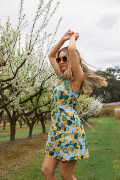 Floral printed mini shift dress featuring gorgeous hand painted nasturtium flowers. This sleeveless style is made of cotton- fitted bodice into a line shaped skirt - sleeveless style - side ties for a more cinched look - invisible back zipper - made of a smooth cotton- available in blue Product Code: PGFY180 Nasturtium Flowers, Picnic Dress, Baby Outerwear, Midi Skirts, Colorblock Dress, Mini Shift Dress, Smock Dress, Shop Swimwear, Fitted Bodice