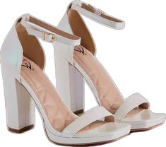 a pair of white high heeled shoes with straps