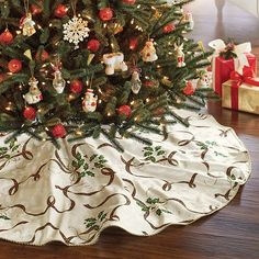 a christmas tree skirt with ornaments on it