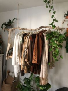 there are many clothes hanging on the rack