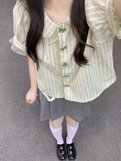 Be styled up and oh-so-adorable in this sweet Striped Harajuku Lace Bow Blouse! Featuring a cute Peter Pan collar, grass green stripes, velvet green bow buttons, and puff sleeves – this blouse is the perfect way to rock the Harajuku look in style. Look so very cute without breaking a sweat! 💚 Size Chart: Size Bust (cm) Shoulder (cm) Sleeve (cm) Length (cm) Bust (in) Shoulder (in) Sleeve (in) Length (in) S 118 31 21 43 46.46 12.20 8.27 16.93 M 122 32 22 45 48.03 12.60 8.66 17.72 L 126 33 23 47 4 Green Outfit Korean, Korean Blouse Outfit, Bow Shirt Outfit, Very Cute Outfits, Green Blouse Outfit, Sweet Shirts, Korean Style Outfits, Blouse Korean Style, Korean Blouse