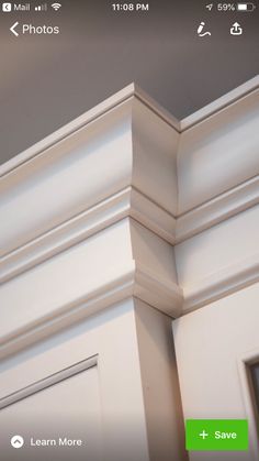 the corner of a white cabinet with an arrow pointing to it's left side