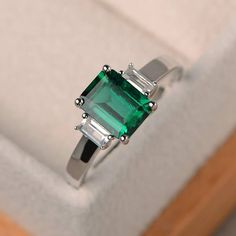 Emerald ring wedding ring emerald cut green gemstone Emerald Ring Wedding, Three Stone Engagement Rings Emerald, Wedding Ring Emerald Cut, Wedding Ring Emerald, Wedding Rings Emerald Cut, May Birthstone Rings, Urban Jewelry, Green Gemstone Ring, Ring Emerald Cut