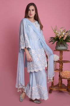 Powder blue straight kurta with all-over floral motif applique-dori work and scallop hem. Comes with sharara pants and tassel dupatta.
Component: 3
Embroidered
Neckine: Round
Sleeve Length: Three Quarter
Fabric: Kurta and Pant: Silk Chanderi; Dupatta: Chiffon
Color: Blue
Side slits
Tassel dupatta
Flared sleeves
Keyhole neck - Aza Fashions Chiffon Sharara, Nishat Linen, Kurta Sharara Set, Chanderi Dupatta, Kurta Sharara, Blue Kurta, Pakistani Designer Suits, Summer Lawn, Indian Dresses Traditional