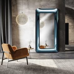 a chair and mirror in a room