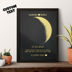 a black framed poster with a yellow moon on it and the words i love you