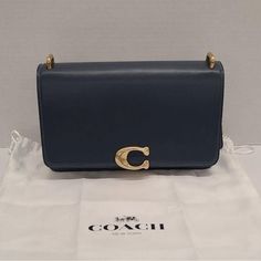 Coach Luxe Refined Bandit Shoulder - Across Body Bag Height: 6.0 " (Size One Size) Length: 9.5 " (Size One Size) Width: 3.5 " (Size One Size The Bag Comes With Dust Bag. Nice Piece, Excellent Condition Like New. Feel Free To Ask Me Any Questions. Have A Great Day. Bags Coach, Denim Color, Across Body Bag, Colored Denim, Have A Great Day, Body Bag, Coach Bags, Dust Bag, Color Blue